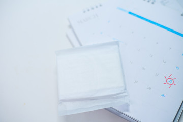 White sanitary napkin with calendar.