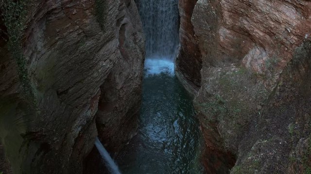 Beautiful Waterfall near Trento, Italy; Orrido di Ponte Alto; slow camera pan down