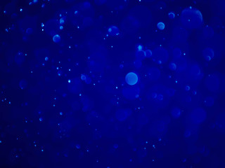 Obraz premium Abstract blue bokeh background.Blurred bright light.