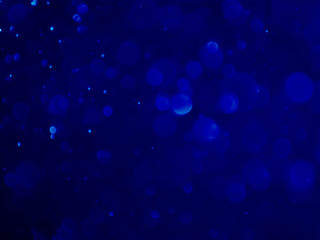 Abstract blue bokeh background.Blurred bright light.