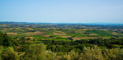 Fototapeta premium Traditional countryside and landscapes of beautiful Tuscany. Fields and vineyards. Holiday, traveling concept. Agro tour of Europe. Beautiful world.