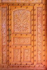 Wooden door of temple. Nandgaon