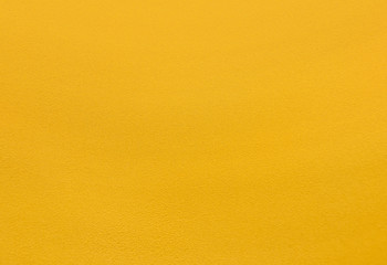 deep yellow coarse plaster wall