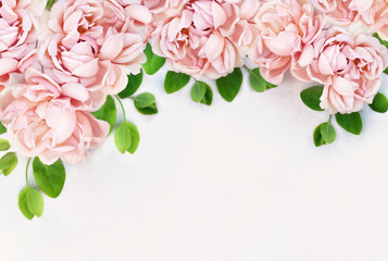 Delicate blossoming roses and blooming flowers festive background, pastel and soft bouquet floral frame card, toned