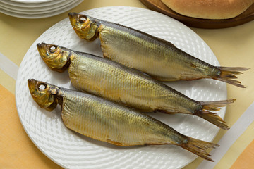 Three whole Bucklings, hot smoked herring