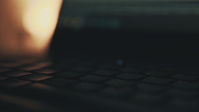 Laptop  keyboard slow pan shot, macro shallow field of view