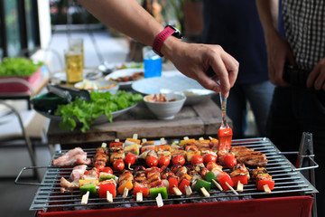 Barbeque Grill Street Food in thailand,Eat outdoors in a happy family.