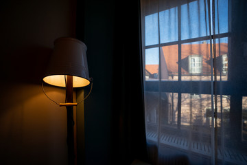 Electric lamps on the fin of the window in the German interior. Munich