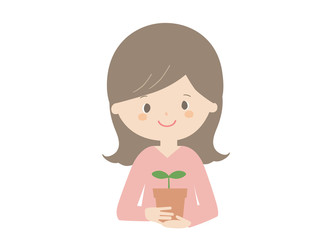 Woman holding a seedling