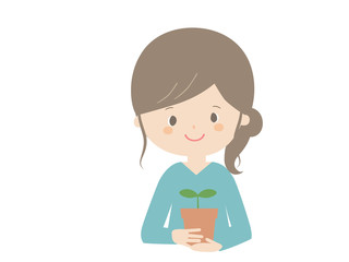 Woman holding a seedling
