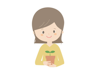 Woman holding a seedling