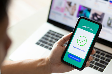 using smartphone and laptop online shopping
