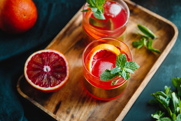 Summer cocktail with blood orange and mint.