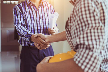 Engineering shaking  Hands Architectural with the agreement to agree on a residential construction project.concept