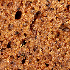 Black rye bread as an abstract background