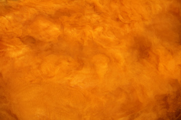 abstract blurred outlines of mixing substances. foggy orange mystery