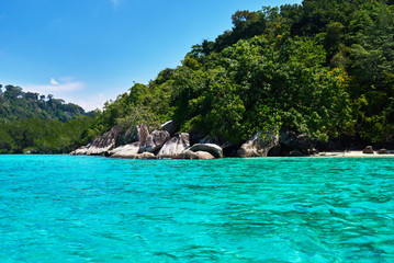 Turquoise sea, rain forest, rocks, ocean. Exploring tropical paradise island. Perfect getaway. Relaxing. Travel concept and idea. Beautiful azure ocean.