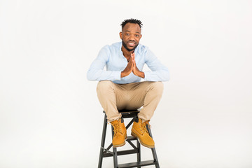 handsome young african man in a shirt on a white background