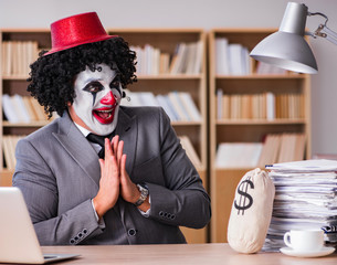 Clown businessman working in the office