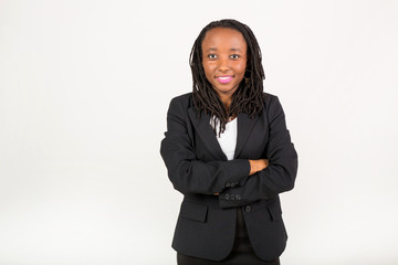 Naklejka na ściany i meble beautiful young african woman in a black suit on a white background