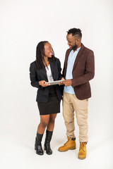 beautiful young african man and woman in suits on a white background