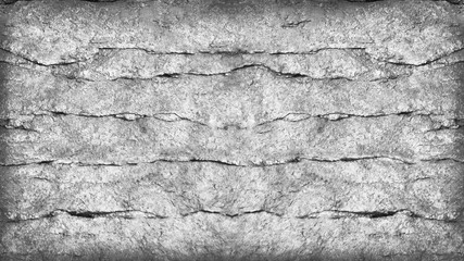 Abstract white black background. Grunge gray background. Stone background with copy space. Rocky cracked texture. Close-up. Monochrome.