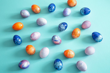 Easter colored eggs on a colored background.