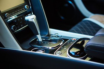Detail of modern car interior, gear stick.