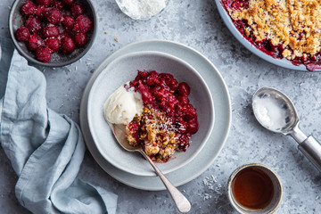 delicious cherry crumble pie served with vanilla ice cream