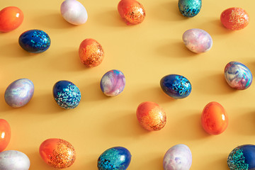 Easter colored eggs on a colored background.