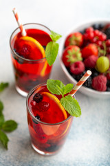 Fresh summer berry drink with lemon and mint.