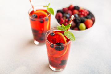 Fresh summer berry drink with lemon and mint.