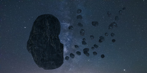 asteroid and swarm of meteorites flying towards Earth - artistic vision.3d illustration