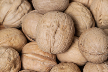 Bunch shelled unpeeled raw walnuts detailed macro