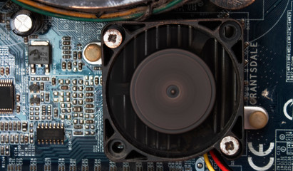 Fan and radiator. Chipset. Motherboard. Old computer. Electronic background