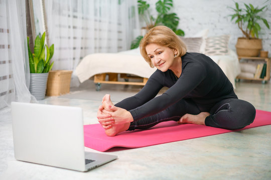 Fitness Training Online, Senior Woman At Home With Laptop