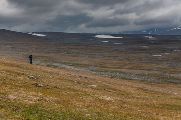 Fototapeta na wymiar long distance Hiker on the Kungsleden hiking Trail in Lapland - Sweden