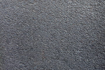 Close-up,Small grey concrete pebble texture with rock background, abstract cement mixed with black stone texture. Sand stone background for exterior and industrial construction concept design, surface