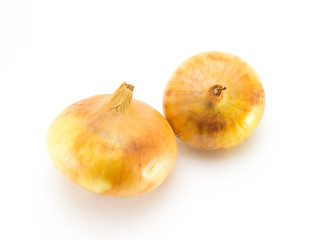 Obraz premium Two ordinary bulbs of brown color on a white isolated background. Not perfect, grown at home, on their own.