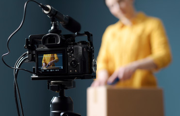 Vlogger making an unboxing video for her channel