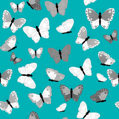 Black and white butterflies on green background