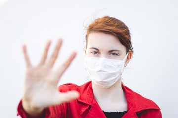 Keep distance! Young Woman With Medical Face Mask. stock photo