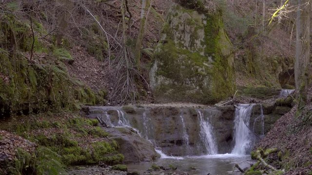gorge in solothurn with beautiful little waterfalls leads to a place of choice where a Christian hermit used to live