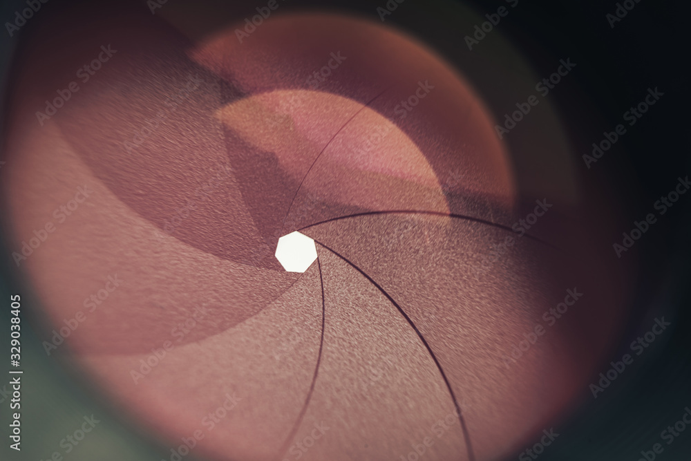 Poster Beautiful camera lens with red  light of glass. Background pattern for design..