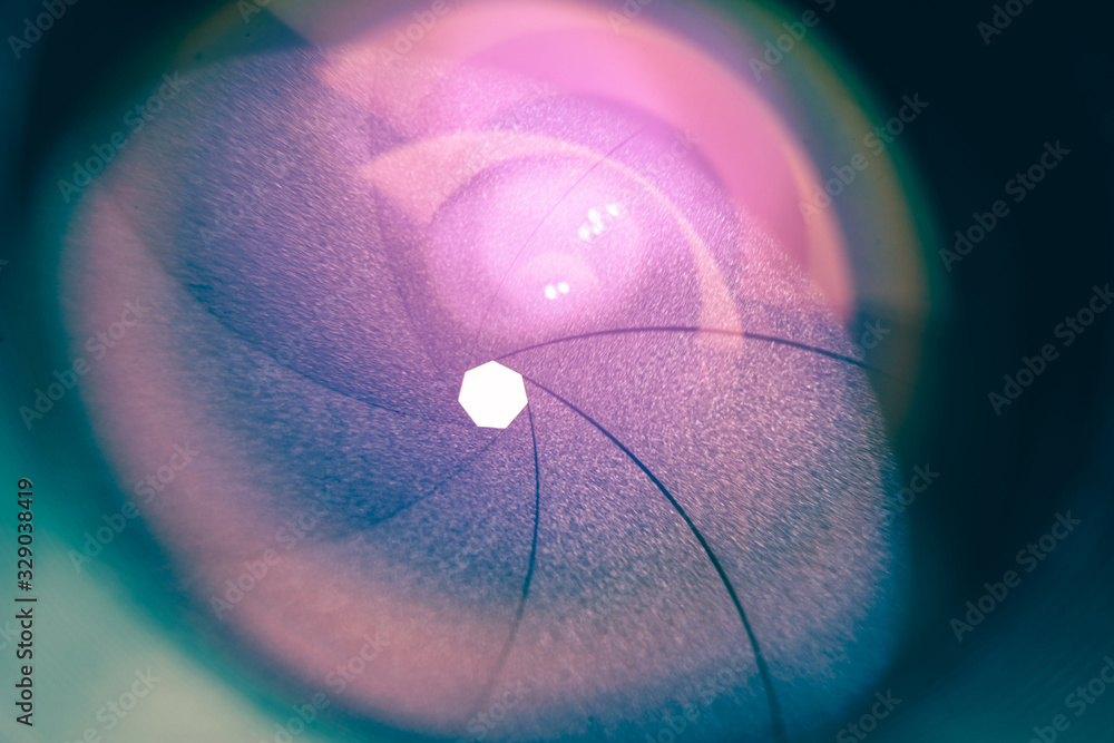 Poster beautiful camera lens with purple light of glass. background pattern for design..