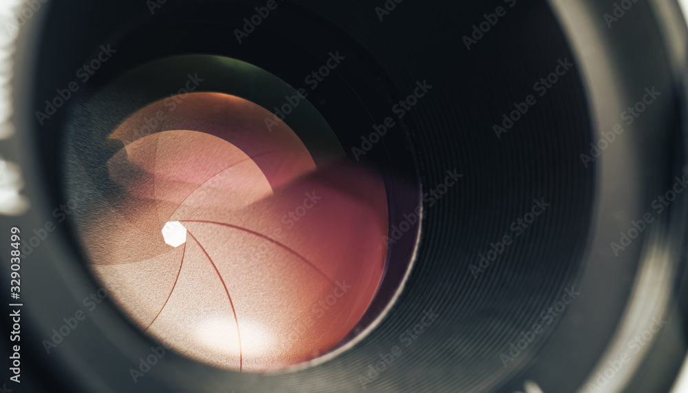 Poster beautiful camera lens with pink light of glass. background pattern for design..