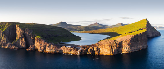 Aerial view from drone of Sorvagsvatn lake on cliffs of Vagar island in sunset time, Faroe Islands,...