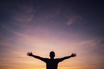 Copy space of man rise hand up on sunset sky and cloud abstract background.