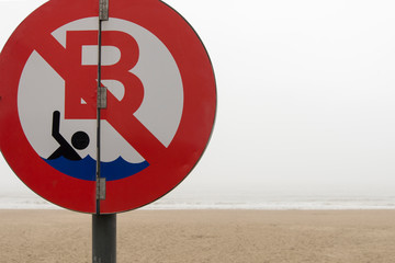 No swimming sign at the beach.