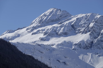 beautiful sunny day with clear blue sky in the snow capped alps in austria